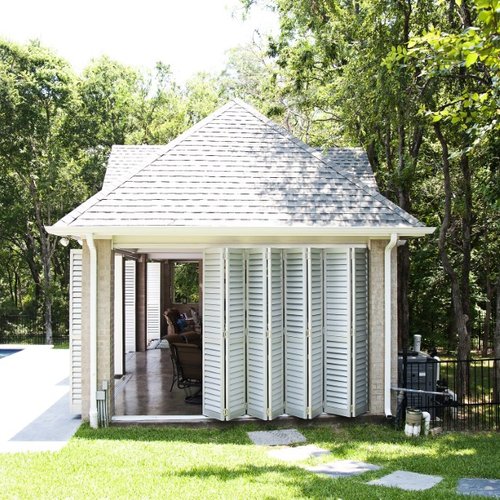 Accordion door shades in a pool house