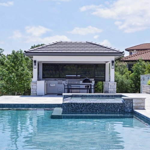 Pool house in Texas with roller shades
